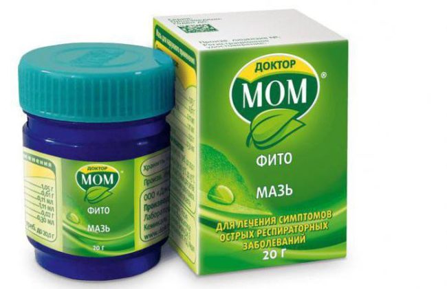 На белом фоне зелёная упаковка с лекарственным средством в синей баночке "Доктор МОМ"
